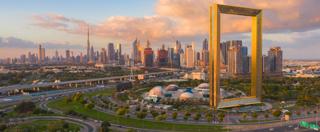 Panoramic background image of a modern city skyline at sunset
